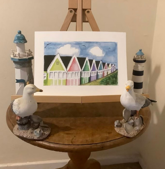 BEACH HUT PROMENADE, A4 print from Julie Eyton's original watercolour depicting colorful beach huts.