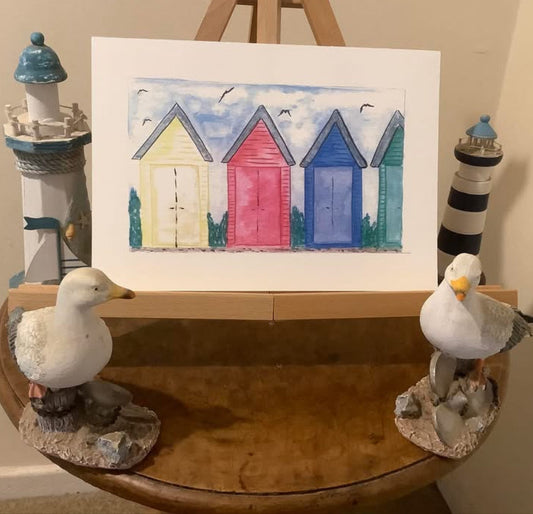 THREE BEACH HUTS