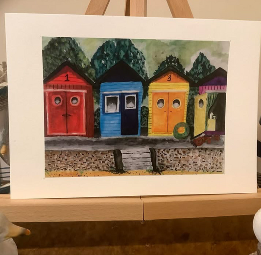 BEACH HUTS AT TWILIGHT.